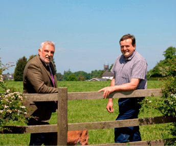 Colin Muller with David Holdcroft in field planned for residential development