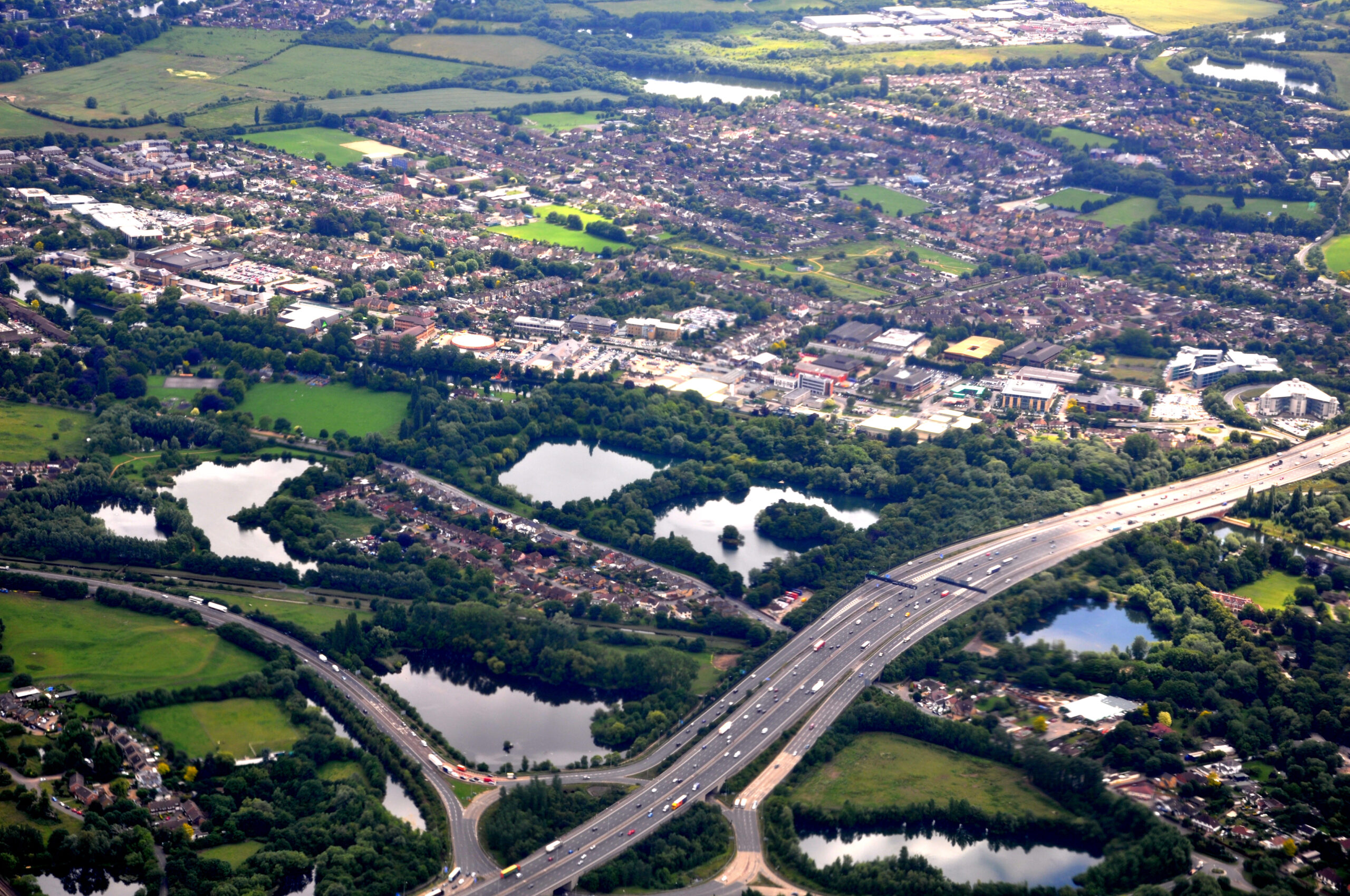 Aerial view of Egham town looking south west up from the M25 junction.